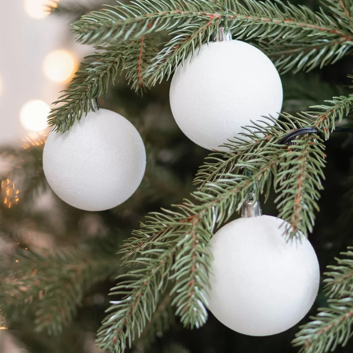 It's all about Christmas Plastic Christmas Baubles-12 White Glitter Christmas Baubles In A Convenient Box