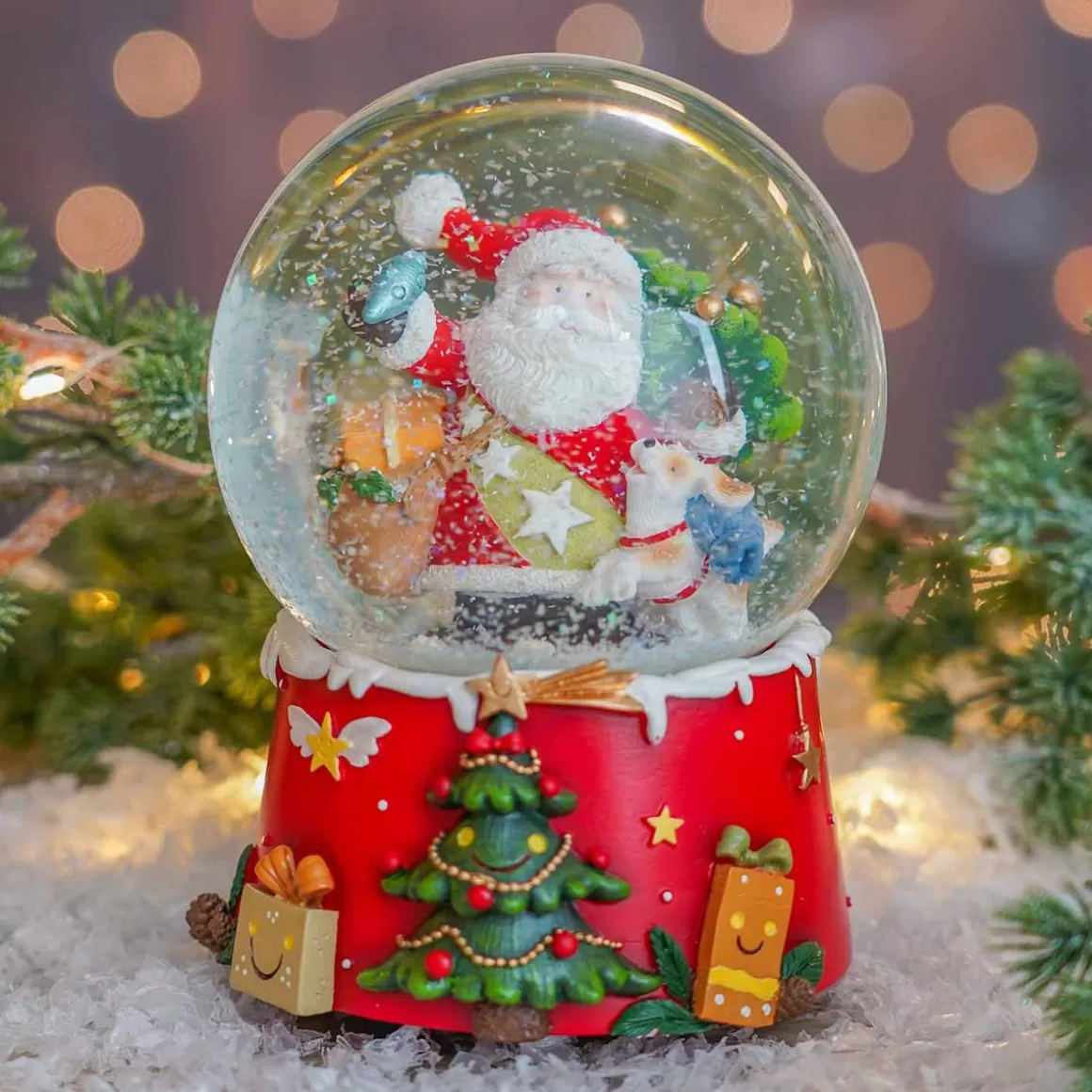 It's all about Christmas Snowglobes-Snow Globe With Santa And Dog | Music | ⌀9cm | 15cm Tall